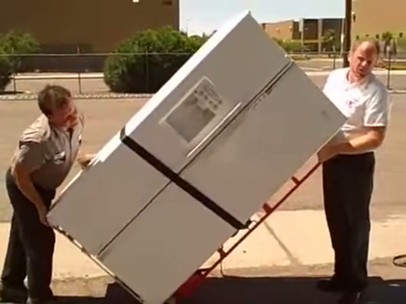 Conan Moving crew handling a piece on a DFW job